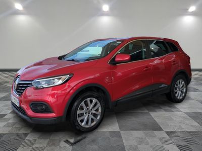 a red 2019 chevrolet c - hr suv parked in a garage