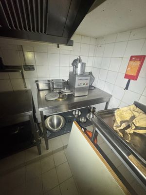 an image of a kitchen with a stove, sink, and oven
