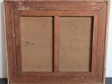 an old wooden picture frame with a picture of a cat in it