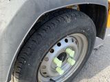 a close up of a tire on a yellow truck