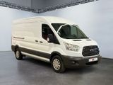 the white van is parked in a large room with a gray floor