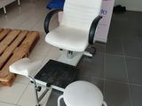 a chair and a stool in a room with pallets