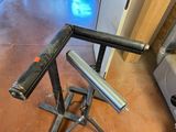 an image of a metal pipe holder in a garage