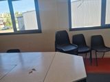 a room with a table and chairs in it