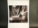black and white photograph of a woman sitting in a chair