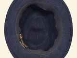 a close up of a hat with a yellow tag on it