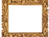 an old gold frame with a decorative design on a white background