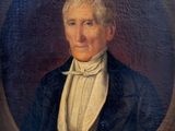 portrait d'un homme vêtu d'un manteau bleu et d'une chemise blanche