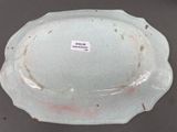 a white plate with a red line on it