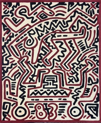 a red and white rug with black and white designs on it