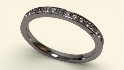 a close up of a diamond ring on a white background
