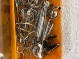 many spoons and spoon spoons in a yellow box