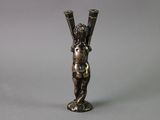 bronze figurine of a cupid holding a pair of tennis racquets