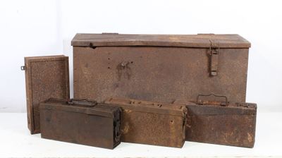 several old suitcases are lined up on a white surface