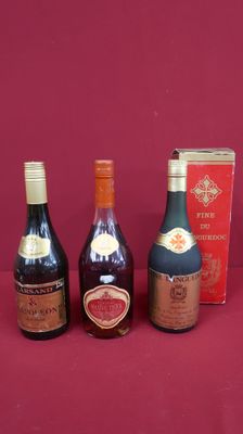 four bottles of wine are lined up on a red surface