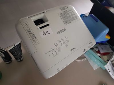 a white printer sitting on top of a desk