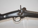 an old gun that is on display in a museum