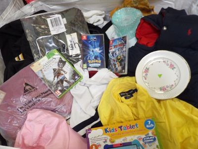 a box full of children ' s clothing and toys in it