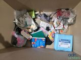 a cardboard box with many items in it