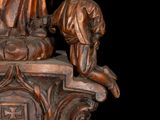 a statue of a man and a woman on a pedestal