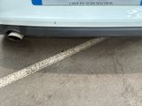 a close up of a car parked in a parking lot