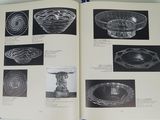 an open book with pictures of glass bowls and bowls on a table