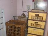 a room with a lot of boxes and crates on the floor