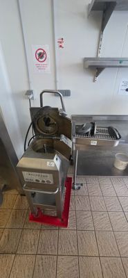 a machine that is sitting on the floor in the kitchen