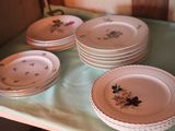 many plates that are sitting on a table