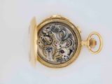 an image of a close up of a pocket watch on a white surface
