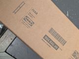 a box that has a barcode on it sitting on a table