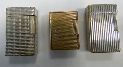three different types of lighters are lined up on a white surface