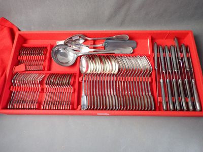 a red tray with silverware and spoons in it