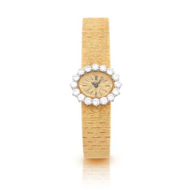une montre-bracelet en or 18 carats sertie de diamants