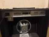 a speaker that is sitting inside of a speaker box