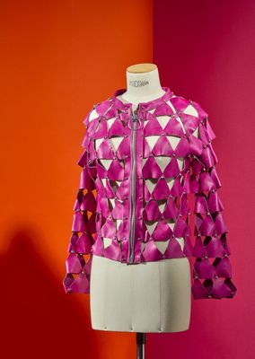 a close up of a mannequin with a pink jacket on it