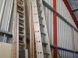 many ladders that are leaning against the wall