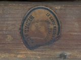 a close up of a wooden box with a clock on it