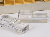 two clear boxes that are sitting on a table
