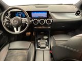 the interior of a car with a steering wheel, dashboard and dashboard controls