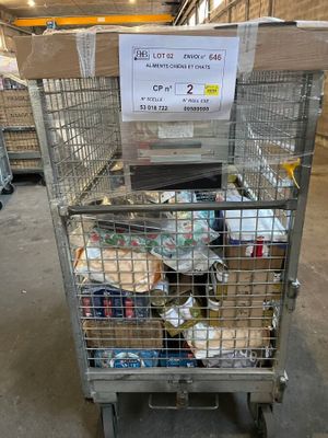 a metal cart with a sign on it in a warehouse