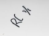 a picture of a white wall with graffiti written on it