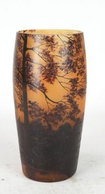 a vase that has a picture of a tree on it