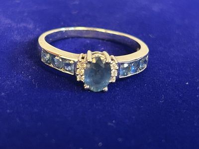 a close up of a ring on a blue surface