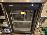a glass door that is open in a kitchen