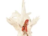 statue of a white rooster with a red comb on its head