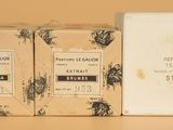 two boxes of soap sitting next to each other on top of a table