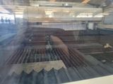 a reflection of a conveyor belt in a glass case