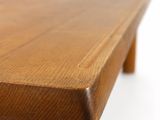 a close up of a wooden table on a white background