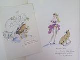 deux dessins représentant une femme et un chat posés sur une table